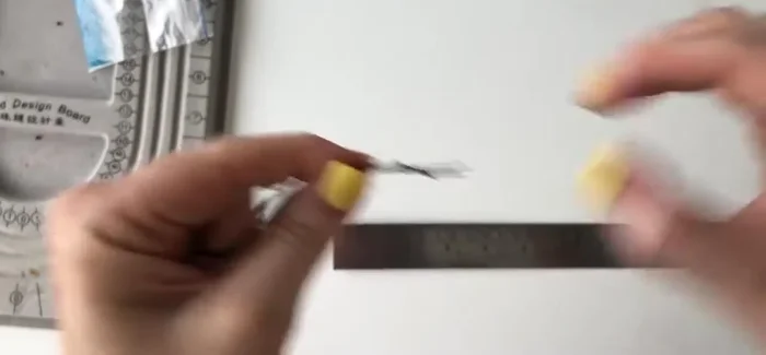 Trim the excess thread ends and use a lighter to seal the ends and prevent fraying.