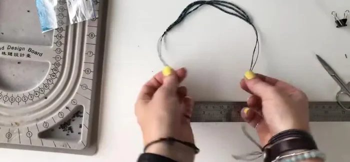 Trim the excess sliding knot threads and seal with a lighter.