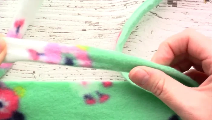 Measure 5 inches up from each corner and cut a 5x5 inch square from each corner.