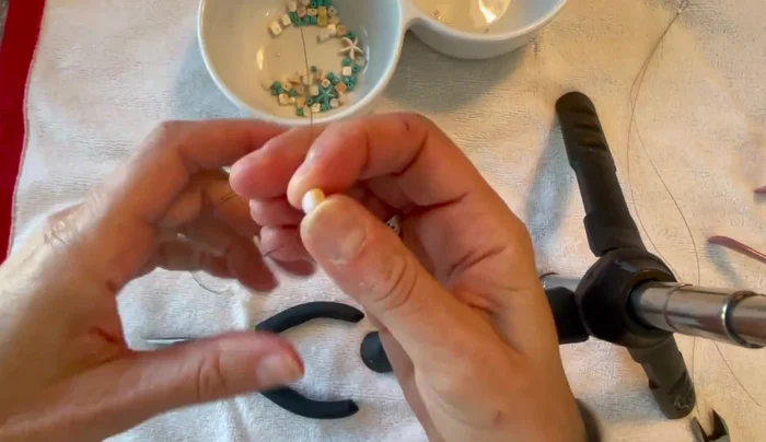 Optional: Add accent beads. At certain points, you can add larger beads or charms to create visual interest.