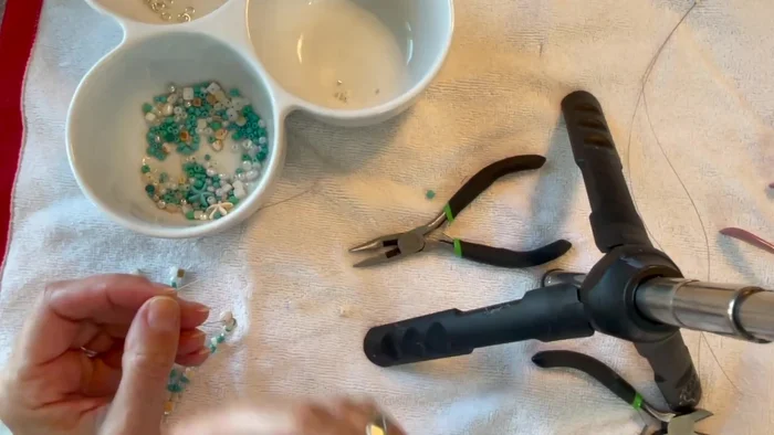 Add a focal bead or charm. Place a larger bead (or charm) as a focal point.