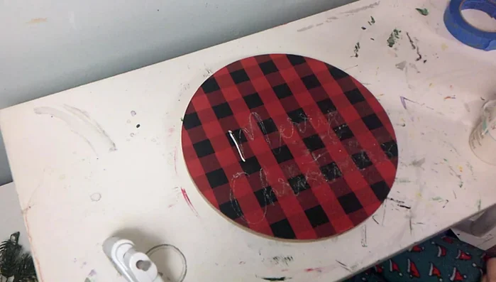 Trace over the chalk transferred text with white paint.