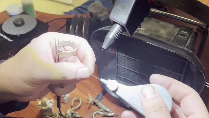 Joining the components: Use a pulse arc welder with sterling silver filler wire, creating ground bevels for a seamless connection.