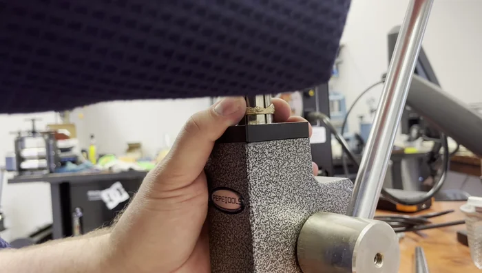 Sizing and fitting: Use a ring stretcher to adjust the gold ring to the desired size, ensuring a pressure fit onto the sterling silver band.