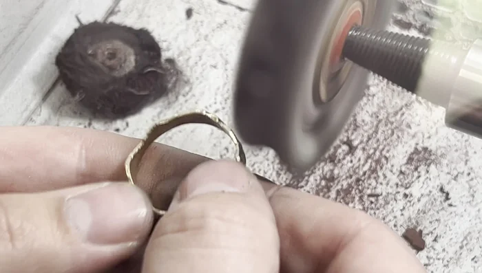 Surface finishing: Sandblast the sterling silver with 20 Micron glass beads for a matte finish. High polish the gold shank for luster.