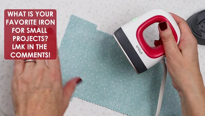 Press the long edges. Fold each of the four corners twice to align with the stitch line and press.