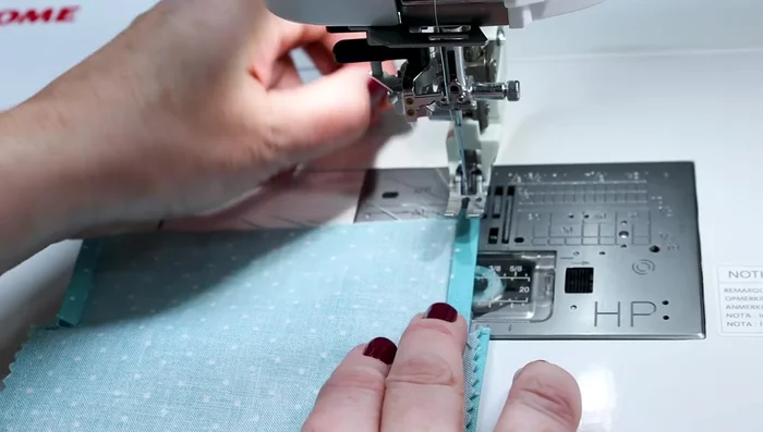 Sew four lines of stitching across the top edge, close to the edge (about a quarter inch).