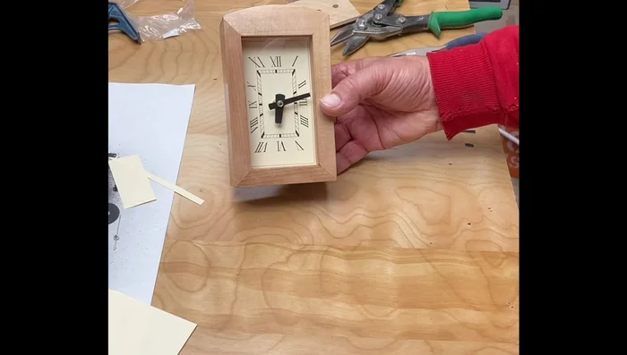 Assemble the clock: Insert the clock face into the inner box, add the clock movement, slide in the glass, and secure with the back piece.