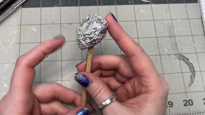 Use a round sculpting tool to indent eye sockets.