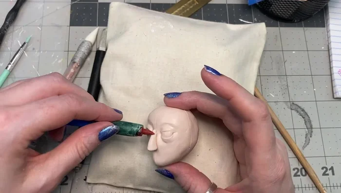 Shape the nostrils and sides of the nose using a pointy tool.