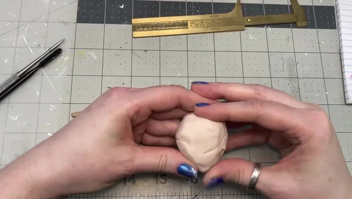 Add small amounts of clay to the forehead, chin, and jaw areas, blending well to prevent cracking.