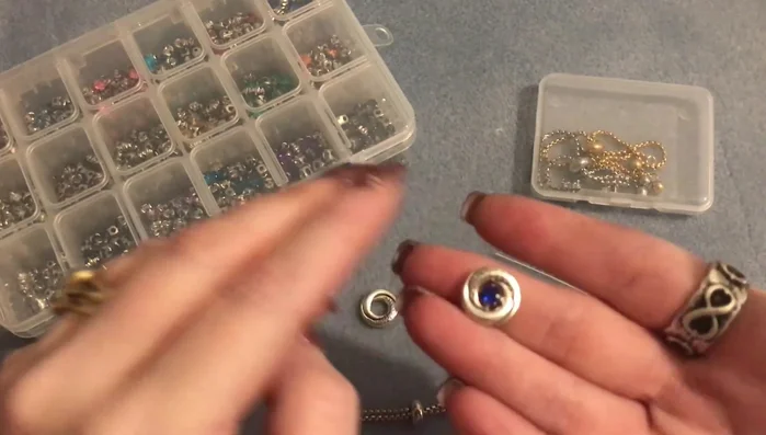 Gently bend the eye pin at a 90-degree angle using round nose pliers to create a loop. Make the loop as tight as possible to the bead to minimize spinning.