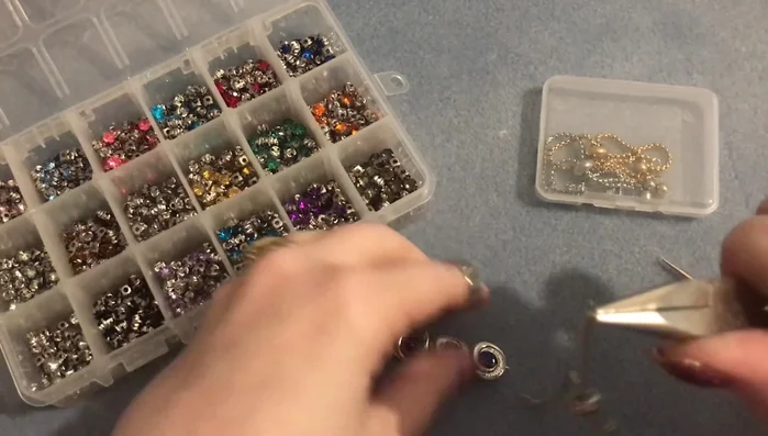 Attach one end of the eye pin loop to a jump ring on one side of the adjustable bracelet finding. Close the jump ring securely. Repeat for the other end.