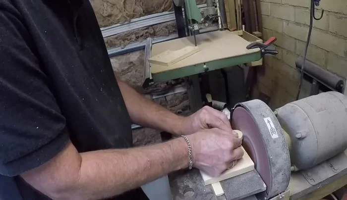 Assemble the wheel by inserting the spokes and attaching the rim to the hub using the jig for precise alignment.