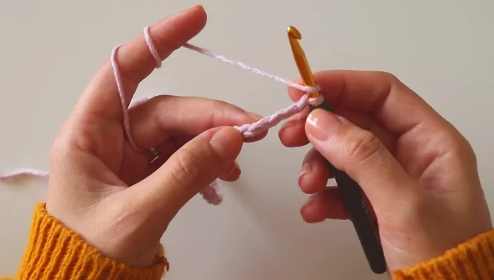 Row 1: Double crochet in the 4th chain from the hook, *skip 3 chains, double crochet in the next chain*. Repeat from * to * across. Chain 1 and turn.