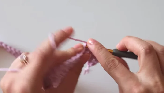 Continue alternating between Rows 2 and the finishing row (double crochet) to complete the blanket.