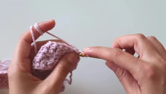 Continue alternating between Rows 2 and the finishing row (double crochet) to complete the blanket.