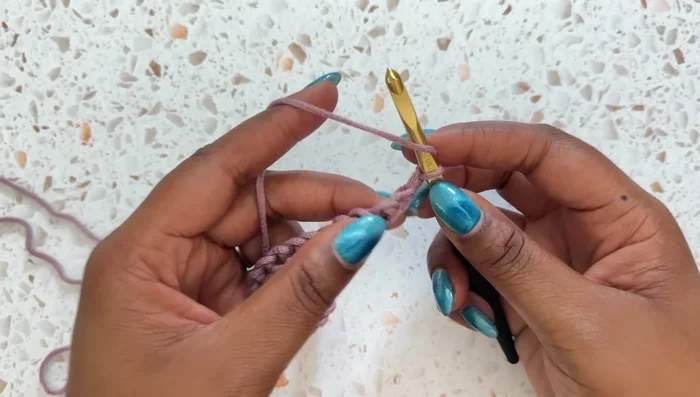 Row 1: Chain 1, then double crochet in each stitch across.