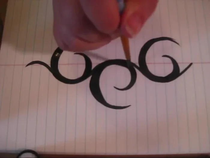 Thicken the original lines of your design by placing the brush in the thicker part of the swoop and pulling outwards.