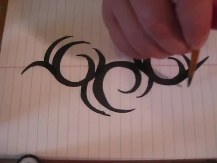 Add ‘legs’ to your design by following the curve of the existing shapes with your brush and connecting them smoothly to the thicker areas. Experiment with extending legs in different directions for varied effects.