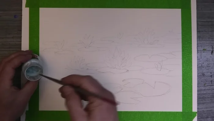 Prepare the paper and apply masking fluid to the lily pads.