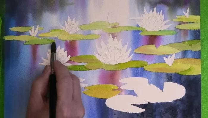 Paint the thickness of the lily pads and their edges with Payne's gray, leaving some gaps.