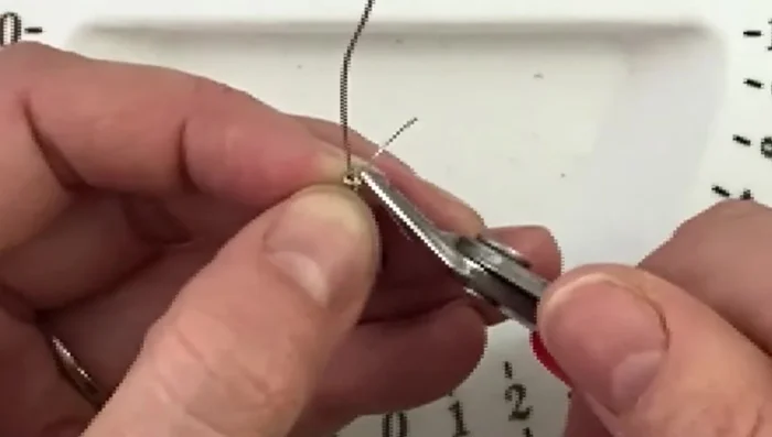 Use round nose pliers to bend the end of the wire at a 90-degree angle.