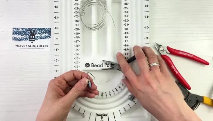 Cut any excess wire and gently tuck the end under the wraps.