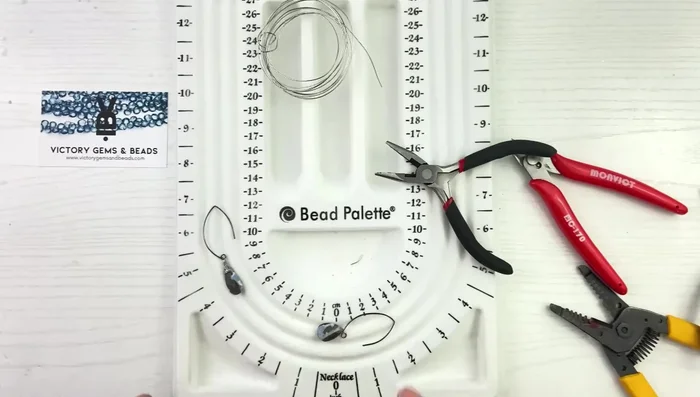 Repeat steps 1-9 for the second earring. Adjust the bead orientation by carefully twisting the wire loop.