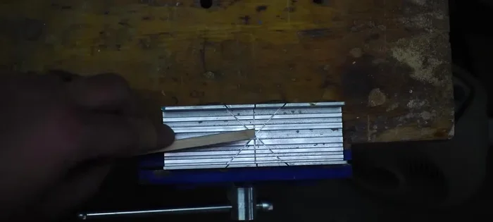 Miter the hickory corners: Use a miter box and exacto knife saw to cut the hickory pieces at 45-degree angles, ensuring a clean edge grain.