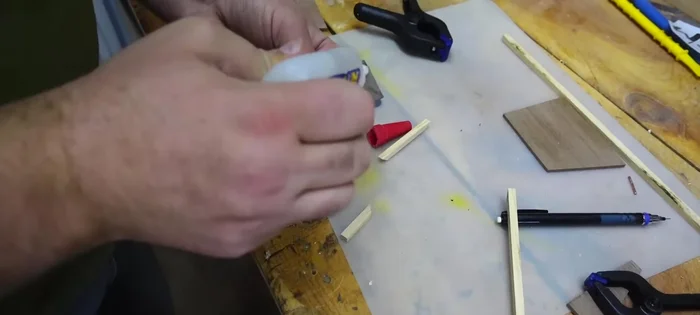 Glue the body pieces: Glue the mitered hickory pieces to the walnut faces using superglue. Ensure quick drying for efficient assembly.