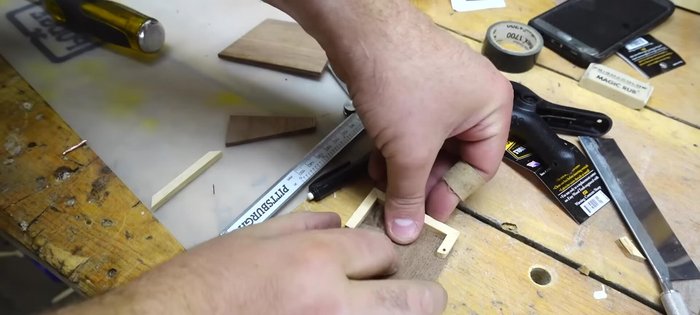 Drill hinge holes: Drill a small hole through the hinge on the lid using a drill press, and transfer these holes to the face pieces using a cordless drill.