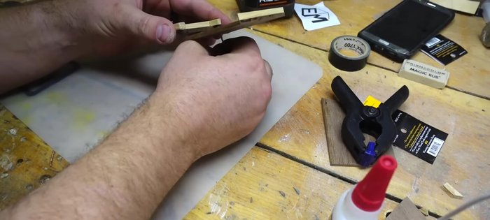 Glue the side pieces: Glue the bottom piece into place, then temporarily attach the lid with a nail to mark hinge and latch placement. Cut the sides to the final length.