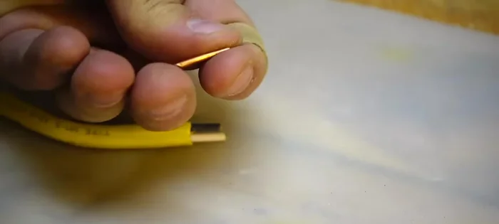 Add the hinge: Use copper wire (or similar material) for the hinge, drilling holes slightly smaller than the wire for a friction fit. Cut the wire flush and sand.