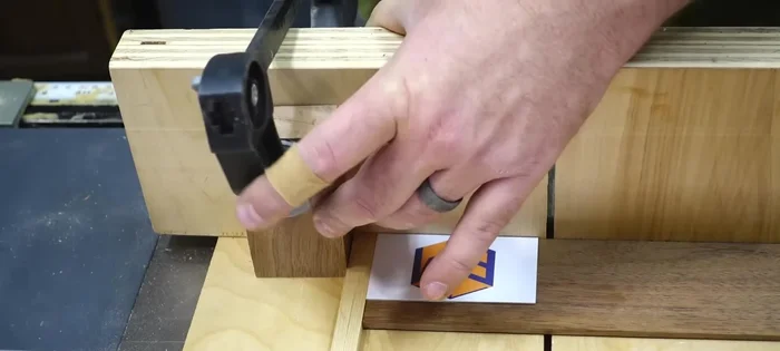 Cut the face pieces: Use the hickory as spacers and a business card to set up a stop block, leaving extra length. Cut the walnut face pieces for the body and lid.