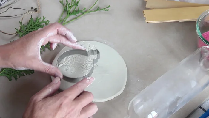 Place cookie cutter on the clay and press gently.