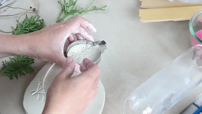Remove the cutter and smooth the edges with a wet finger.