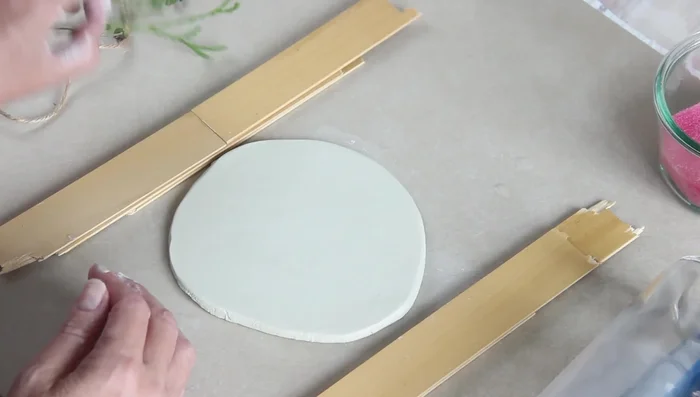 Roll out the clay using thickness guides.