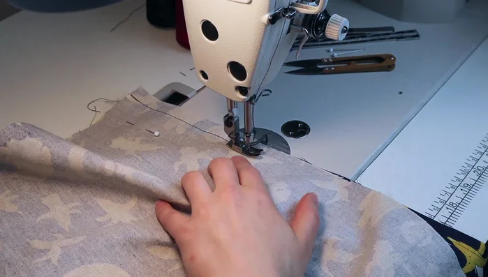 Sew the seams, leaving small openings for the slits. Fold over twice and sew, using tweezers to help with precise folding for the corners.