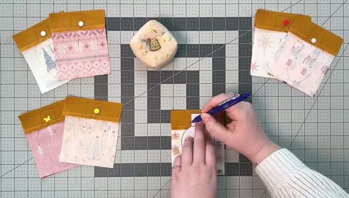 Cut 1/4 inch around the sewn line, trim corners at an angle, and make notches at the bulb's end for easy turning.