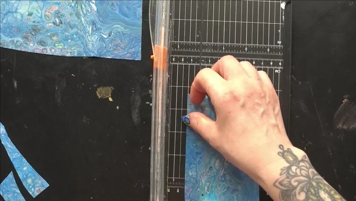 Cut acrylic paint skins into strips using a paper trimmer.