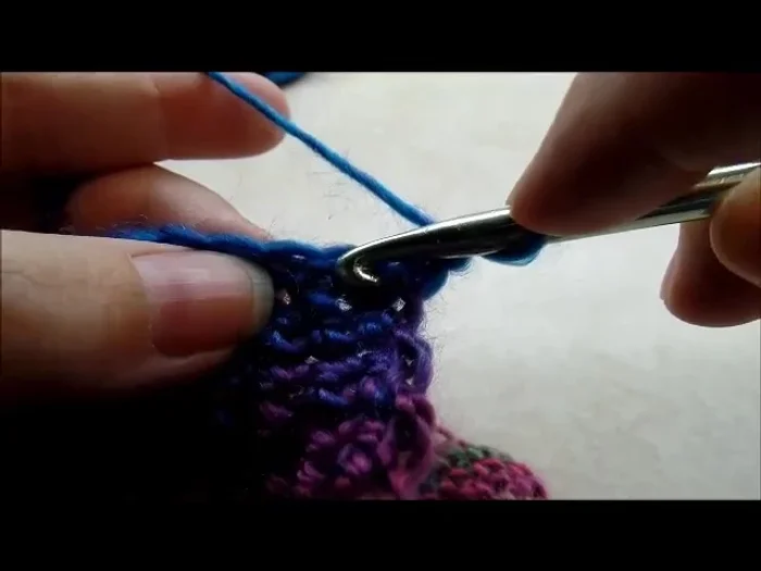 Repeat step 11, decreasing until 4 stitches remain on ear flap. Chain 1, turn, and single crochet decrease twice, then single crochet into last stitch. Fasten off.