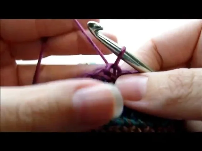 Repeat step 11, decreasing until 4 stitches remain on ear flap. Chain 1, turn, and single crochet decrease twice, then single crochet into last stitch. Fasten off.