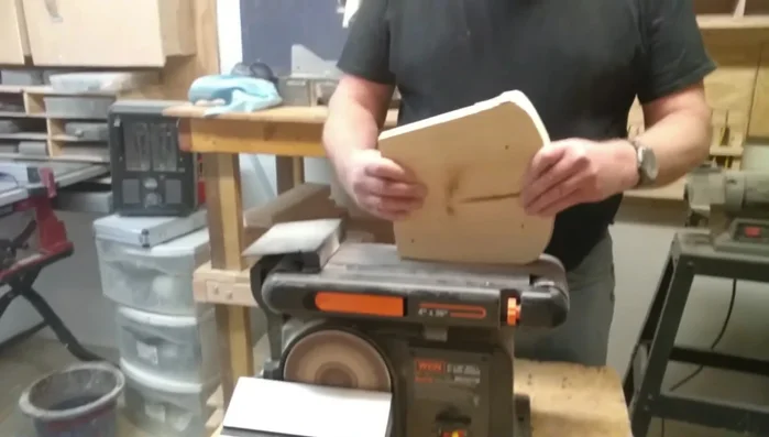 Sand the sides: Smooth down the edges of the side pieces.