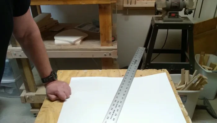 Create the handle: Design and cut a 19-inch long by 3.5-inch wide handle. Make sure it is symmetrical.