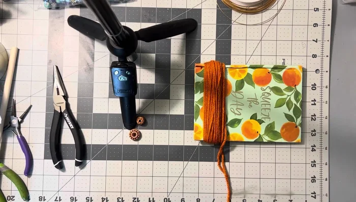 Cut the excess yarn, leaving an uneven end which will be hidden later.