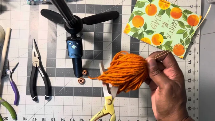Cut the excess yarn, leaving an uneven end which will be hidden later.