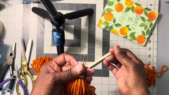 Insert the earring hook into the earlobe, then push the earring back to secure it.