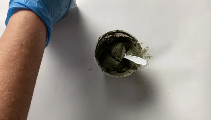 Mix thinset mortar with black oxide for the grout.