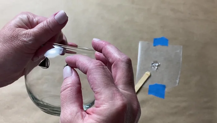 Tile the entire surface of the votive, leaving the bottom clear